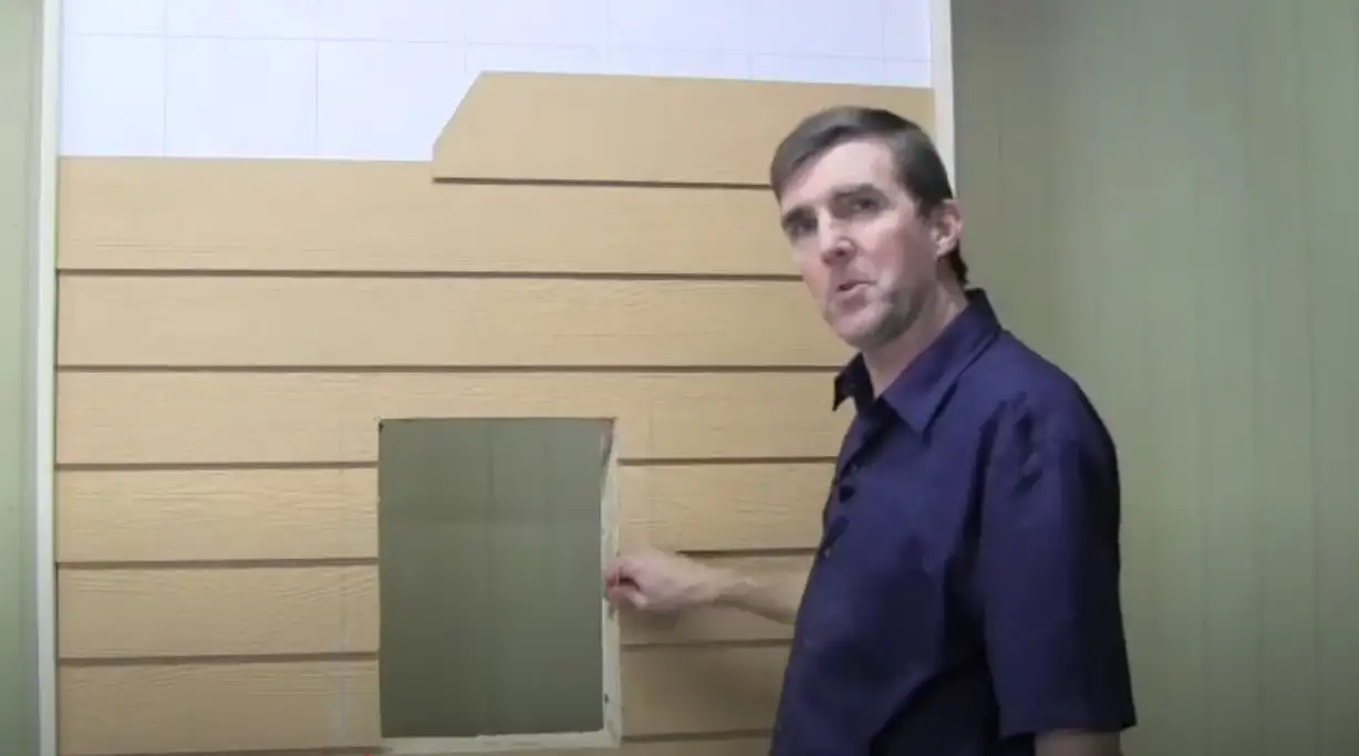 Vidcap showing optional step of cutting siding