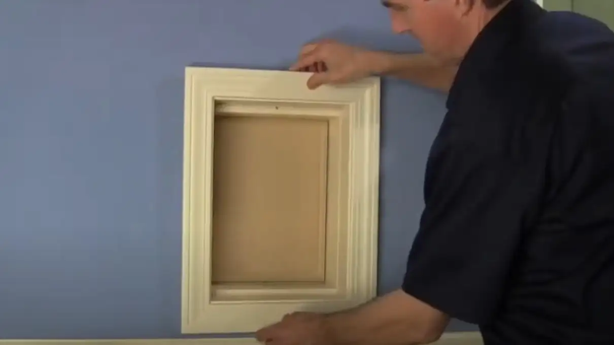 Vidcap showing trim work for pet door